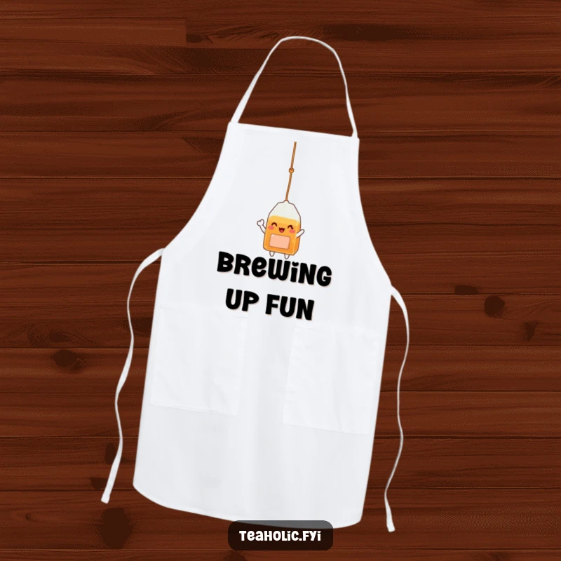 Funny apron showcasing a happy tea bag character dangling and waving, bringing joy to kitchen tasks.