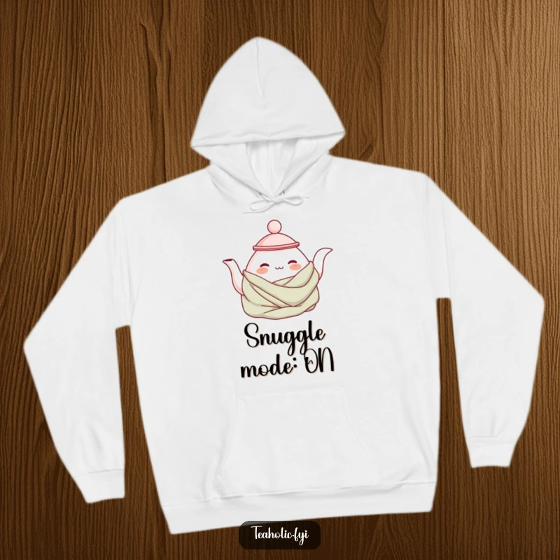 Funny cozy teapot hoodie with a contented teapot character wrapped in a blanket, offering maximum warmth and a humorous, snuggly feel.