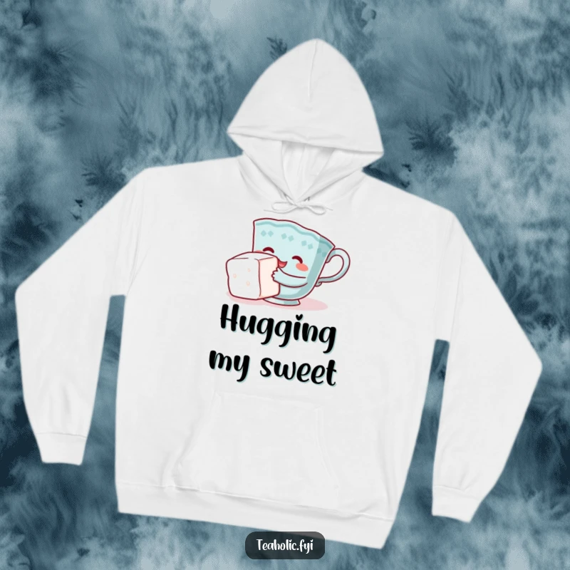 Funny teacup hoodie, character comically hugging sugar cube, cozy and charming design, perfect funny gift.