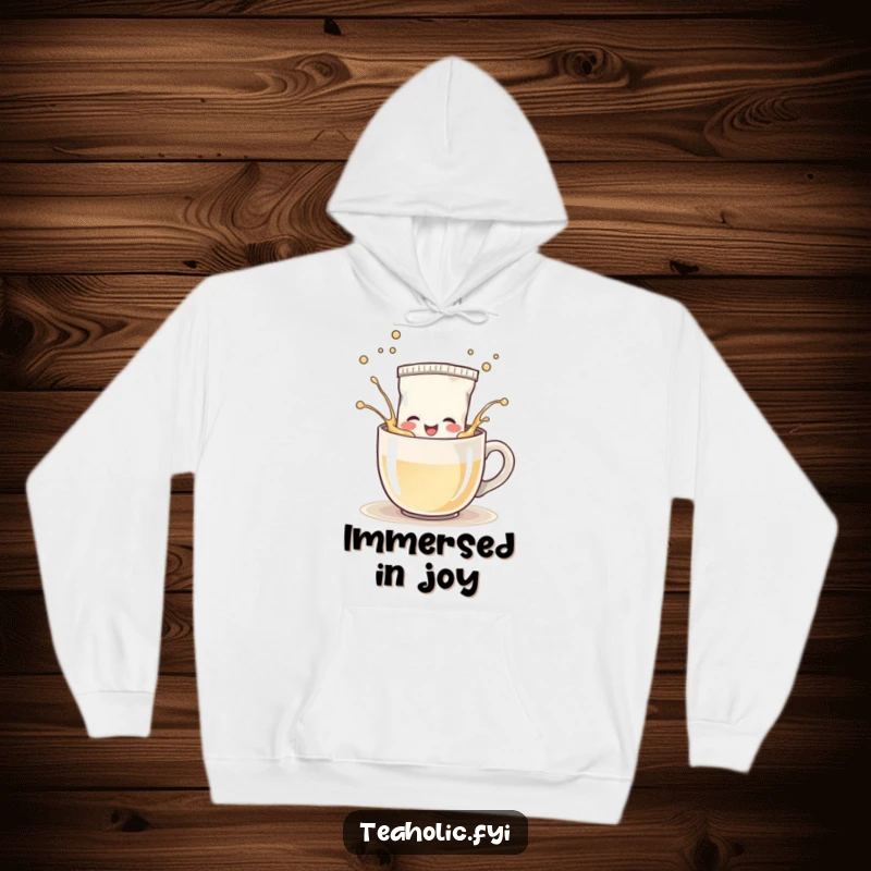 Funny Hoodie: Happy tea bag character splashing playfully in a steaming mug, cozy and full of good cheer.