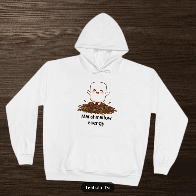 Funny giggling marshmallow character playfully bouncing on a pile of tea leaves, featured on a warm, hooded sweatshirt.