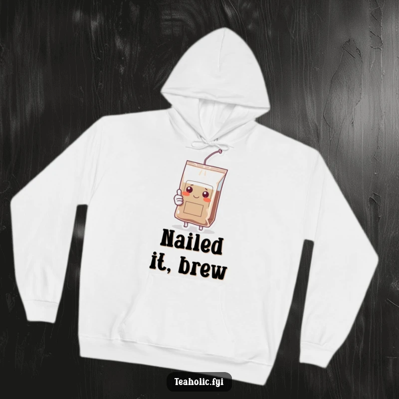 Funny hoodie depicting a smiling tea bag character giving a strong thumbs up, ideal for cozy, humorous moments.
