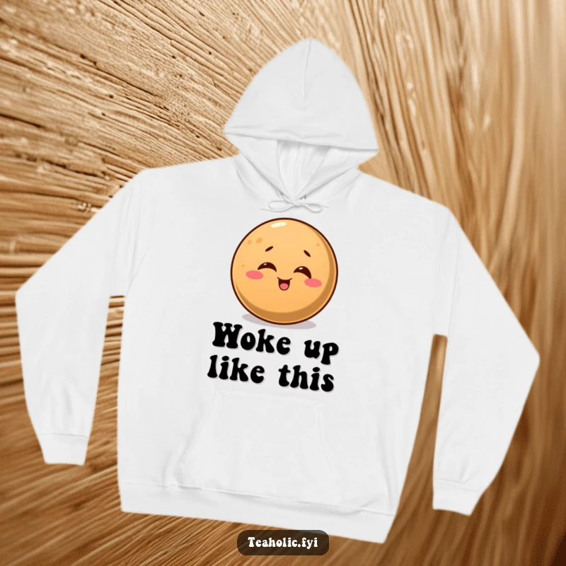 Funny hoodie showcasing a round coffee bean with a cheerful wink, perfect for cozy coffee moments.