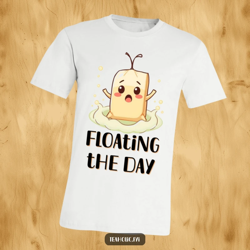 Funny surprised teabag character comically floating on a bubbly tea sea, printed on a comfortable t-shirt.