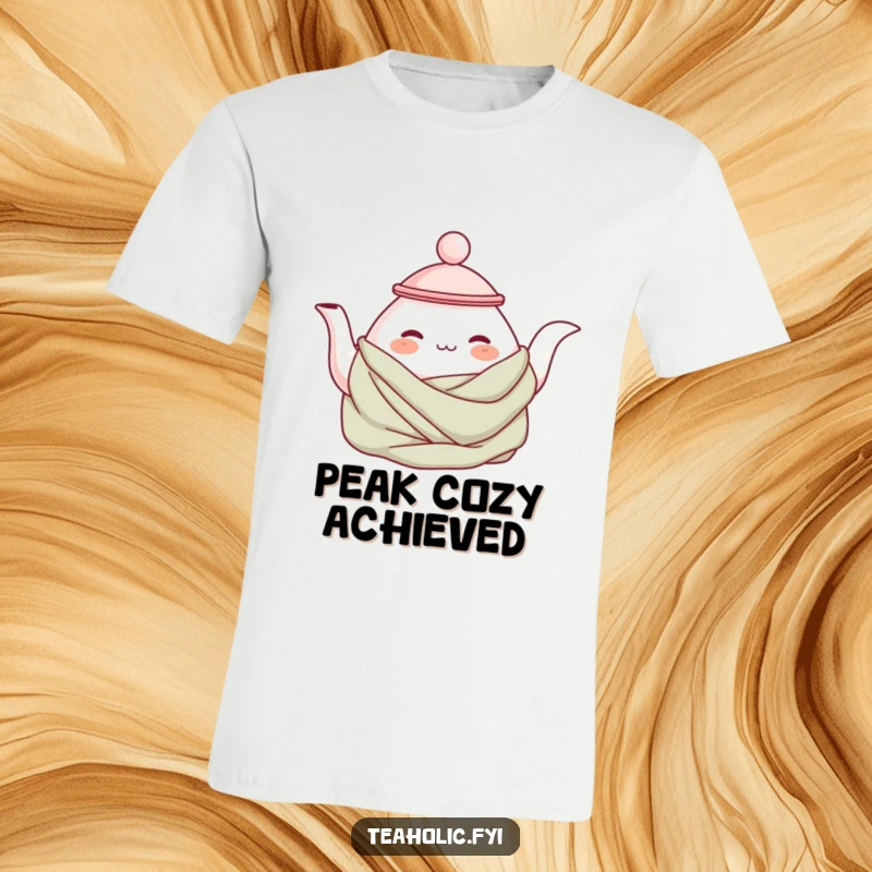 Funny cozy teapot t-shirt featuring a contented teapot character wrapped in a warm blanket, perfect for lounging and relaxation.